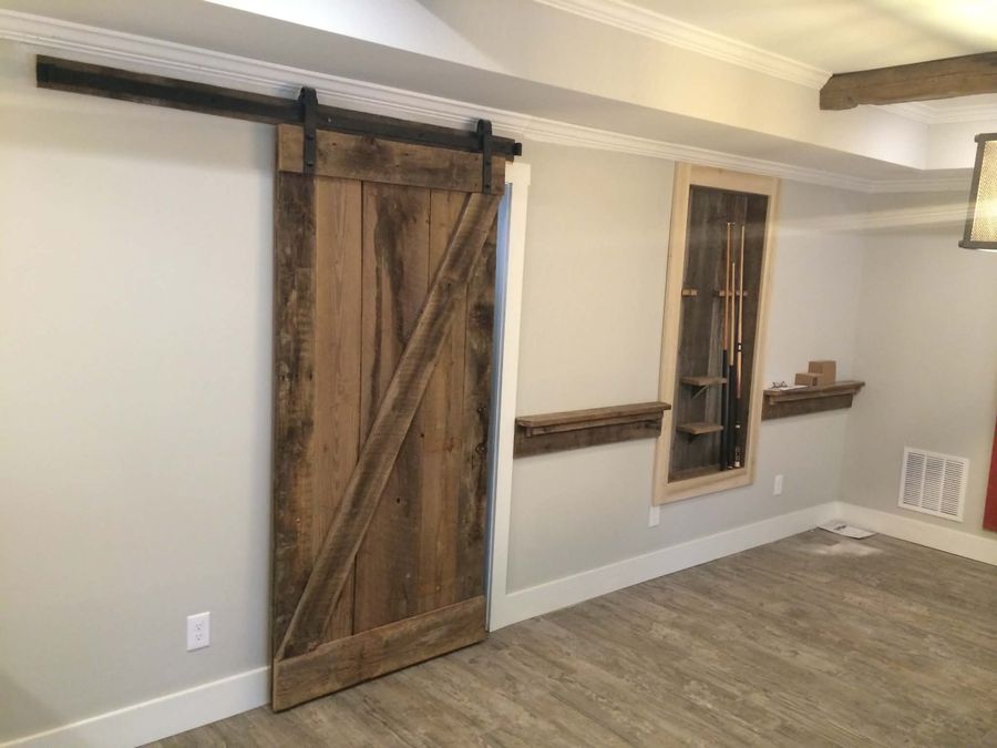 Sliding barn door and reclaimed shelving