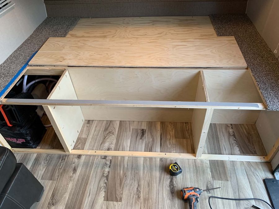 Before — camper bed platform stripped out